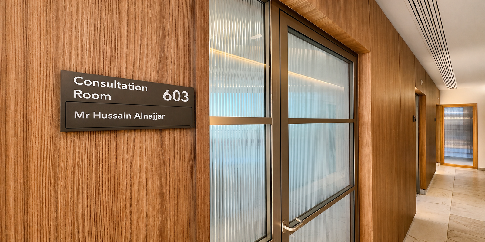 The corridor at 16 Devonshire Street, leading to the consulting room door.